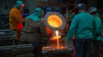 Factor workers pouring molten material | Photo: Boire Benner Group